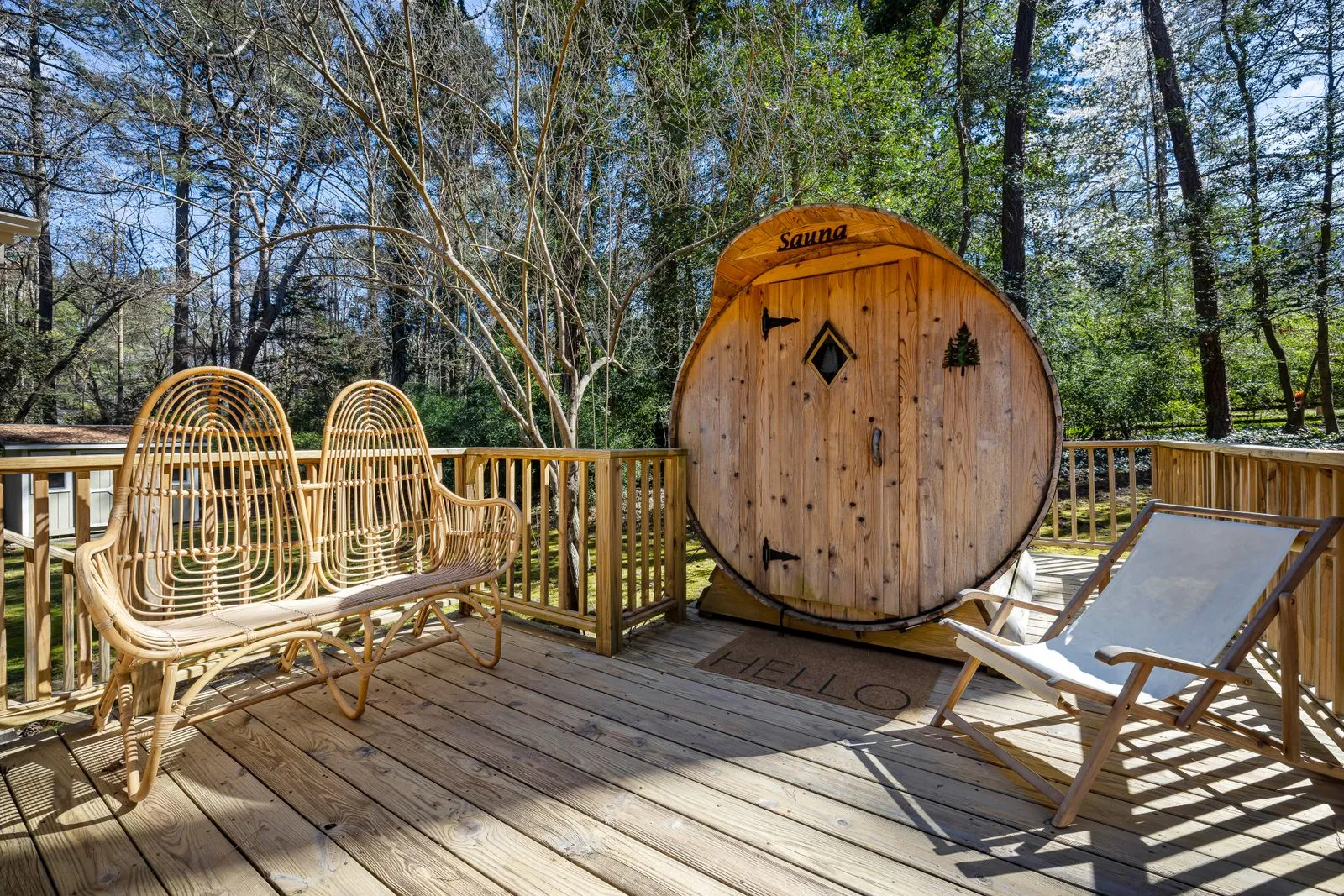 Wooden outdoor sauna on a terrace clad in warm-toned timber