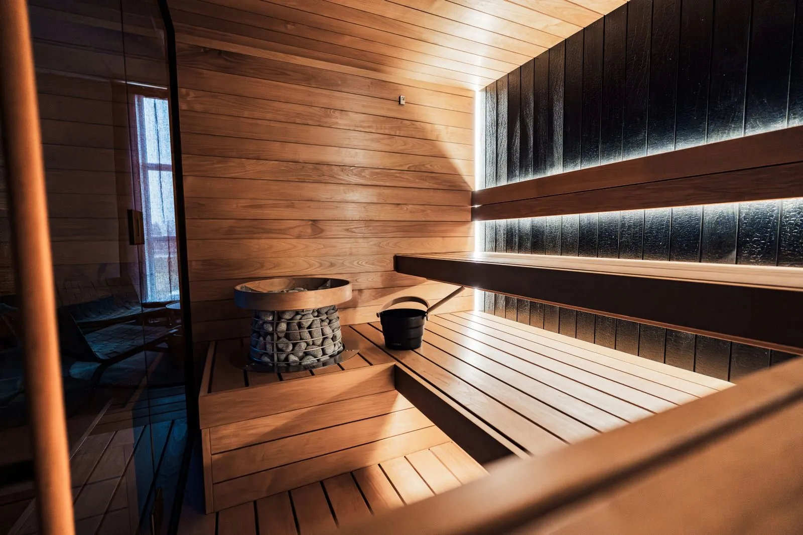 A clean, hygienic sauna interior with towels on the benches