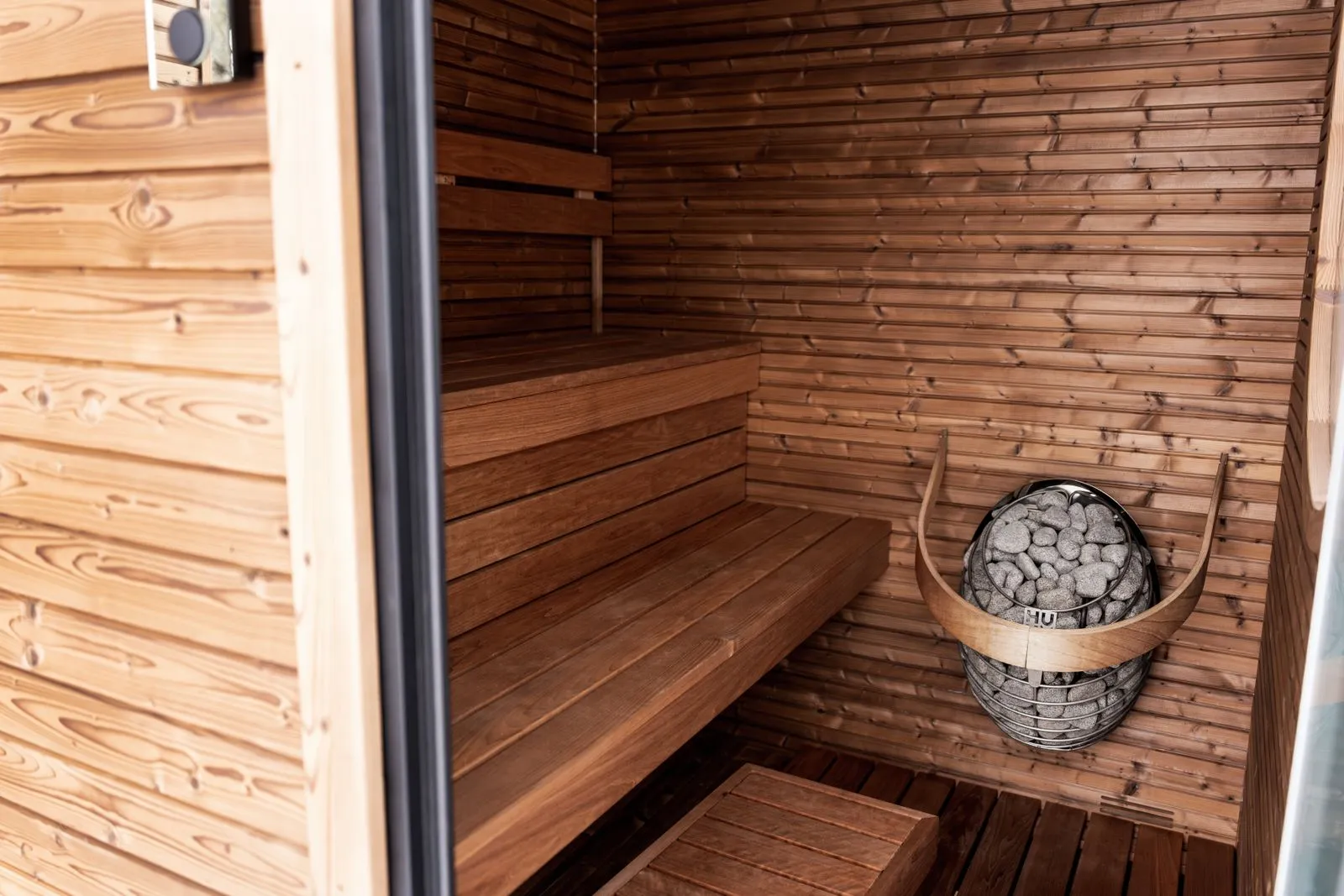 A buyer inspecting a sauna, checklist in hand