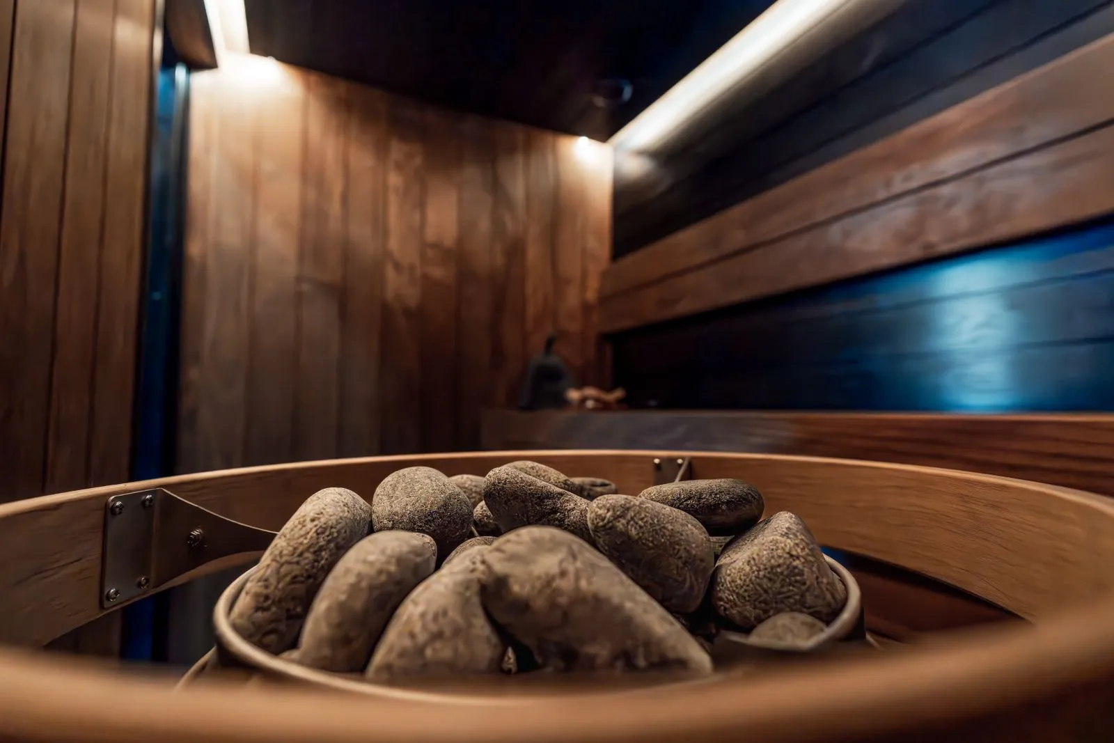 Wooden guard rail surrounding a hot sauna heater