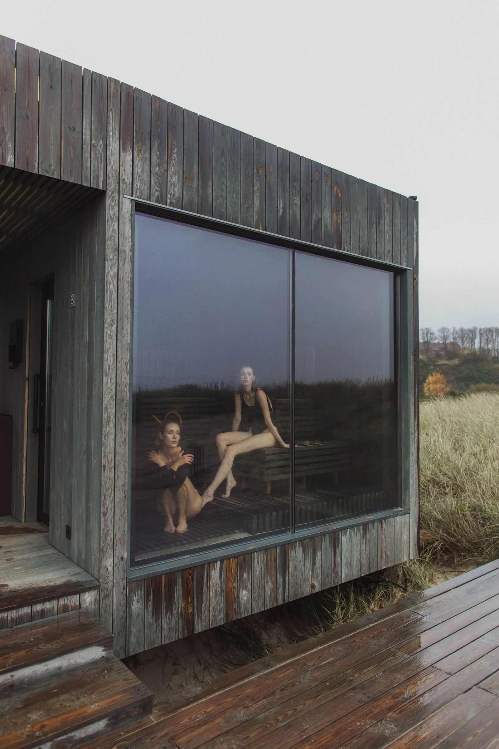 A person unwinding peacefully in a warm wooden sauna