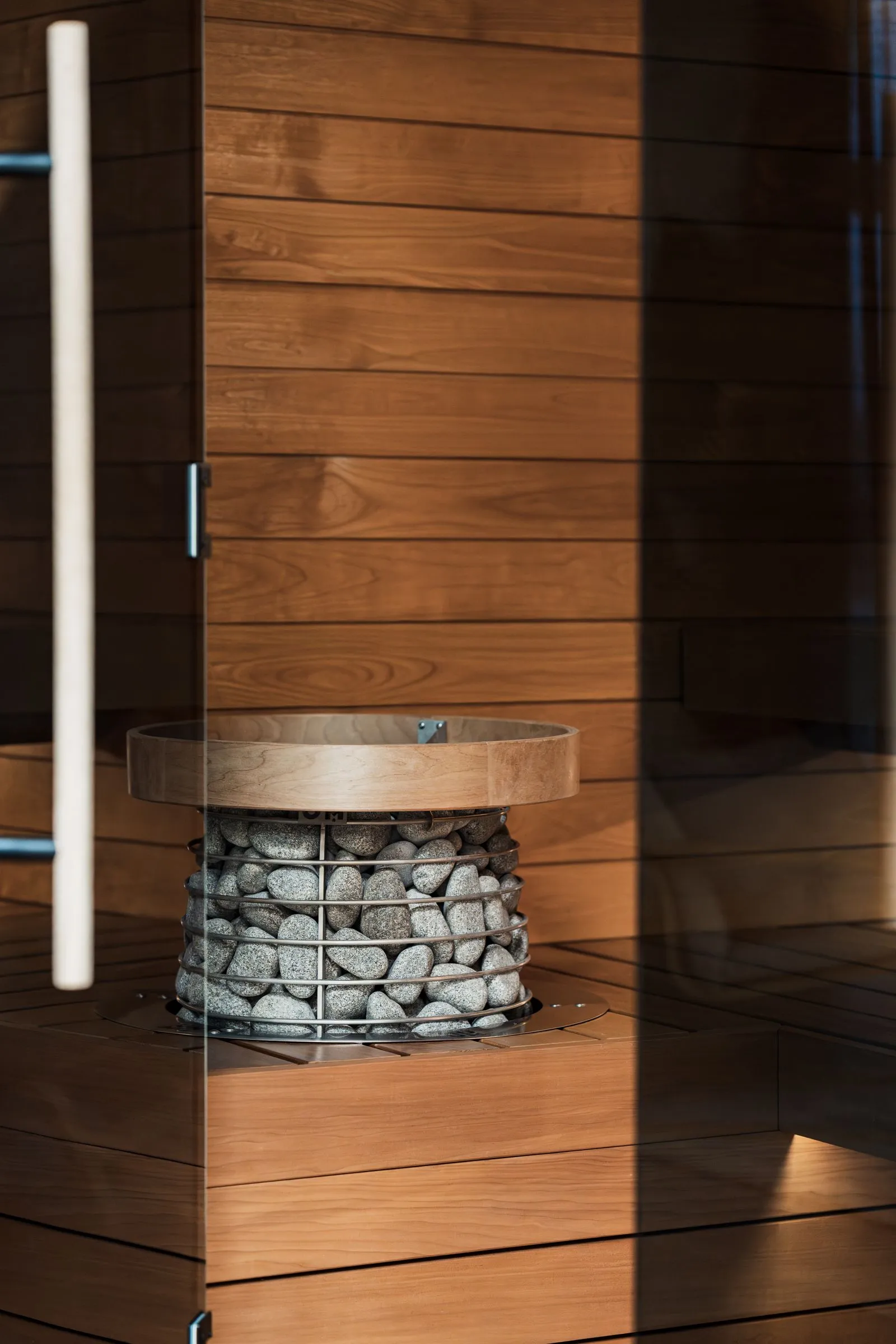 Contemporary sauna interior with clean timber cladding and bench